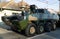 Alba Iulia, Romania - 01.12.2018: Polish service woman standing atop an armoured personnel carrier