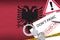 Albania flag and police handcuffs with inscription Don`t panic on white paper. Coronavirus or 2019-nCov virus concept