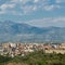 Albanian city Shkoder cityscape with mountain background