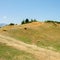 Albanian nature landscape. Sandy hills with rainwater sign on the soil