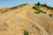 Albanian nature landscape. Sandy hills with rainwater sign on the soil