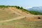 Albanian nature landscape. Sandy hills with rainwater sign on the soil