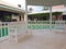 ALBANY, NASSAU. BAHAMAS - JULY 21, 2018. White bench, gazebo in a pool in the garden of a luxury resort