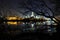 Albany NY at night from Rennsaeler on the Hudson River with light reflections