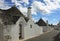 Alberobello road by trulli houses