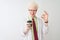 Albino scientist man wearing glasses drinking take away coffee over isolated white background doing ok sign with fingers,