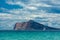 Albir rock and sailboat in crystal water