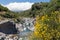 Alcantara gorge with yellow broom flowers at Sicily, Italy