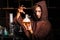 Alchemist in chemical laboratory prepares magical liquids