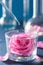 Alchemy and aromatherapy with rose flowers and chemical flasks