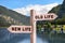 Alcohol addiction: what to choose - life with old bad habits or new good ones? Wooden signpost with different directions against