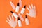 Alcohol-based hand sanitizer, gloves on orange background