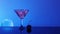 Alcohol cocktail in water on night sky background