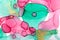 Alcohol ink abstract background. Floral style watercolor texture. Pink, green and gold paint stains illustration.