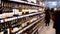 Alcohol Sale in Supermarket. Rows and Shelves of Bottled Alcohol in a Store Window