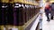 Alcohol sale in supermarket. Rows and shelves of bottled beer on a store window