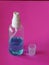 Alcoholic 70 percent in clear Plastic bottle Spray, Hand Sanitizer on pink background washing clean dirty to prevent germs protect