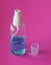 Alcoholic 70 percent in clear Plastic bottle Spray, Hand Sanitizer on pink background washing clean dirty to prevent germs protect