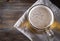 Alcoholic beverage , light barley beer  on a dark wooden , top view