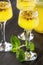 Alcoholic cocktail with fresh passion fruit with mint and ice. D