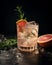 Alcoholic cocktail with grapefruit, soda, ice, gin and rosemary