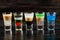 Alcoholic cocktail row on bar table, colorful party drinks