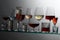 Alcoholic drinks on a tilted glass shelf