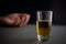 Alcoholism and alcohol abuse glass of whiskey or cognac or alcohol drink