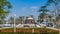 Alcove with green lawn, flowers and trees at Dubai Creek park timelapse. Dubai, United Arab Emirates