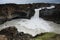 Aldeyjarfoss waterfall with surrounding basalt columns and rocks