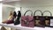 ALDO Expensive things High-heeled shoes and handbags of different colors are on the counter Guildford Town Center Shoe