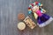 Alegrias y palanquetas, mexican amaranth and seed candies with mexican craft doll on vintage wooden gray background