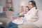 Alert mother and daughter relaxing at home