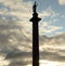 Alexander Column on cloud sky background at sunset.