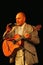 Alexander Dolsky on the Estrada theatre stage singing and reading poetry.