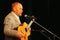 Alexander Dolsky on the Estrada theatre stage singing and reading poetry.