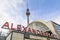 Alexanderplatz train station signage and the television tower in central Berlin at Mitte district, Germany