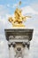 Alexandre III bridge golden statue in Paris
