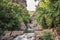 Alge stream running between geological stones of the famous Fragas de SÃ£o SimÃ£o sinuous and green trees, FigueirÃ³ dos Vinhos