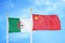 Algeria and China two flags on flagpoles and blue sky