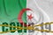 Algeria flag and Covid-19 inscription with orange quarantine border tape. Coronavirus or 2019-nCov virus concept