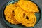 Algeria sweet food named zlabi, in Inde named Jalebi, it is prepared with flour and yogurt and honey and other ingredients