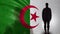 Algerian soldier silhouette standing against national flag, proud army sergeant