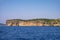 Alghero, Sardinia, Italy - Faro di Capo Caccia lighthouse at the limestone cliffs of the Capo Caccia cape at the Gulf of Alghero