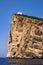 Alghero, Sardinia, Italy - Faro di Capo Caccia lighthouse at the limestone cliffs of the Capo Caccia cape at the Gulf of Alghero