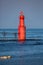 Algoma Pierhead Lighthouse in Algoma, Wisconsin in the summer with a blue sky