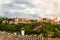 Alhambra panoramic scenic view with cloudy sky in Granada. Andalucia, Spain. Beautiful old Arab building