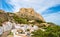 Alicante old town and Santa Barbara Castle on Benacantil hill. Narrow streets and white houses on hillside in ancient