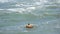 Alicante, Spain, August 20, 2019: Young tourist swimming with his float at the beach