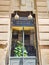 ALICANTE, SPAIN - JULY, 5 2023: View of beer sign board on window, facade of building